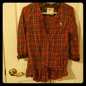 Red plaid blouse with deep v, ruffled trim collar